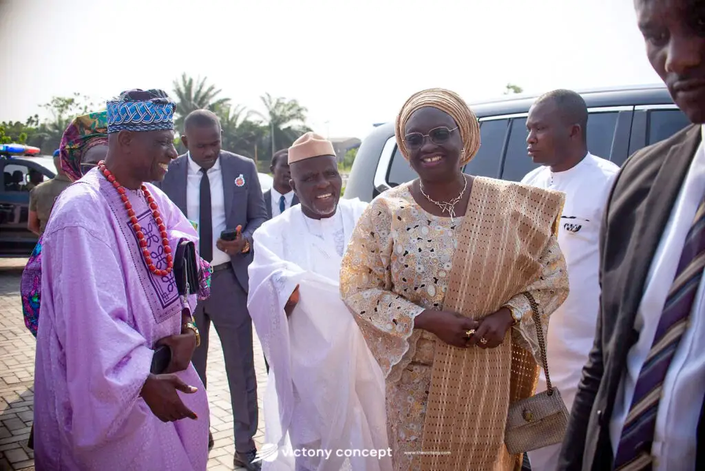 Guests in traditional Yoruba attire with coral beads and lace, arriving at an event styled by Victony Event Planners